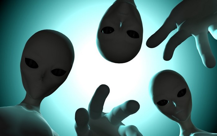 Four aliens and a hand reaching down