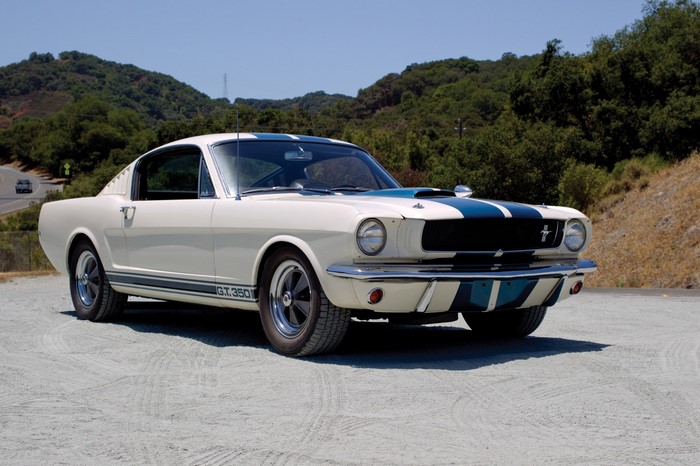White 1965 Shelby GT350 Mustang on a dirt road