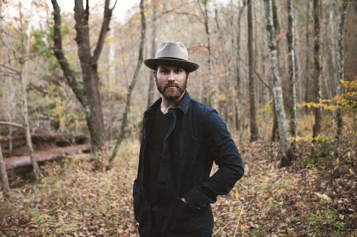 Drake White in a forest