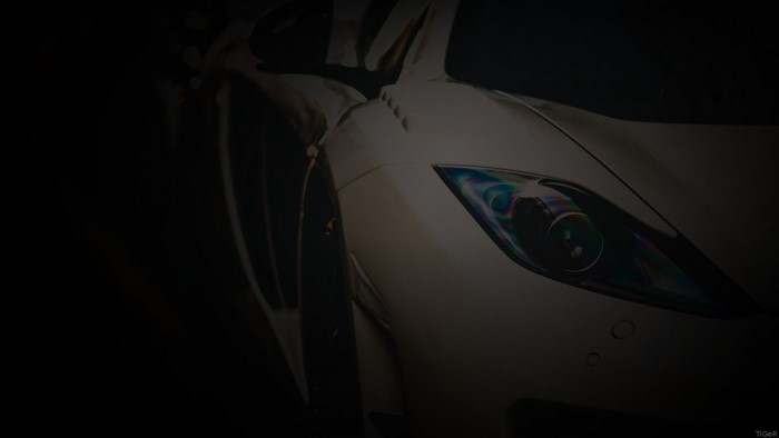 White McLaren sports car headlight