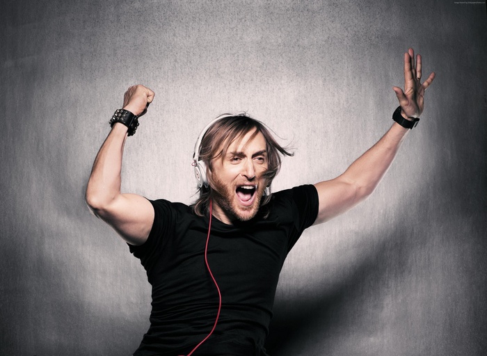David Guetta wearing headphones and black shirt