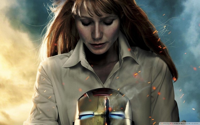 Pepper Potts from Iron Man 3 holding Iron Man's helmet