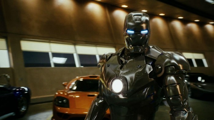 Iron Man in a garage with cars