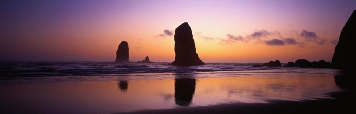 Sea stacks at sunset with reflection