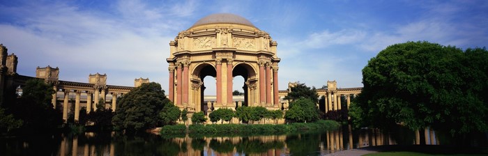 Palace of Fine Arts with dome and colonnades reflected in water