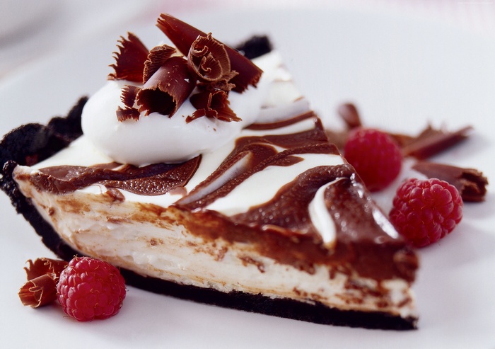 Slice of chocolate raspberry pie with whipped cream