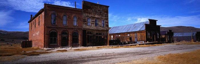 Abandoned Old West Town Buildings Under Blue Sky