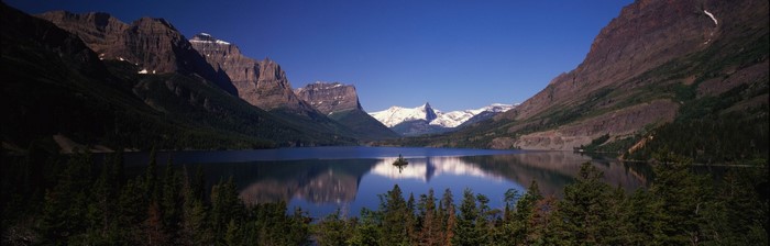 Mountain range reflected in a lake with an island