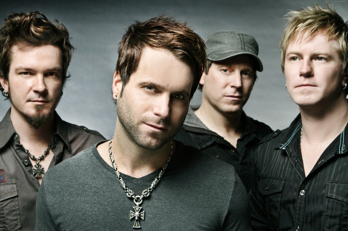 Parmalee band members posing for a photo