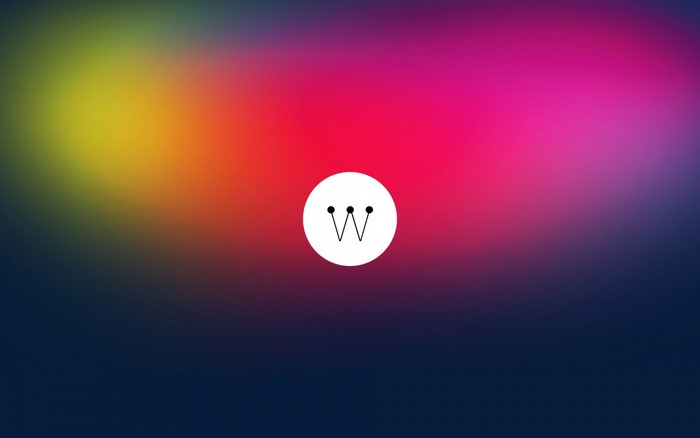Minimalist logo with 'W' inside a circle on a colorful gradient