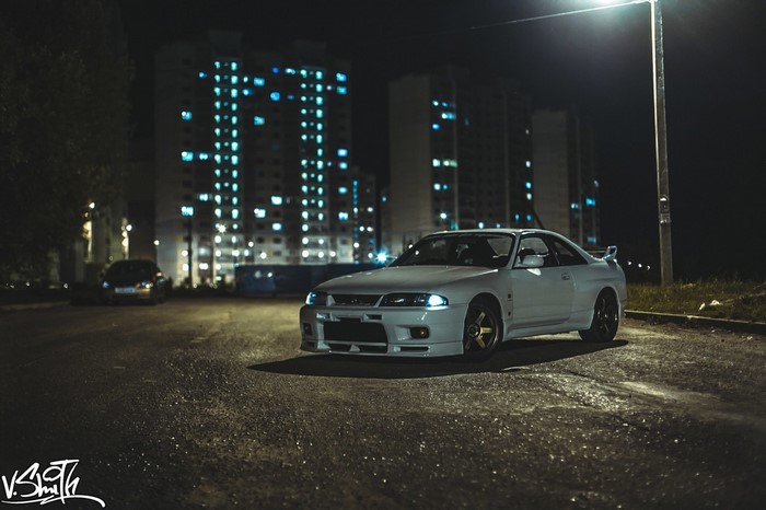 White Nissan Skyline GT-R parked at night