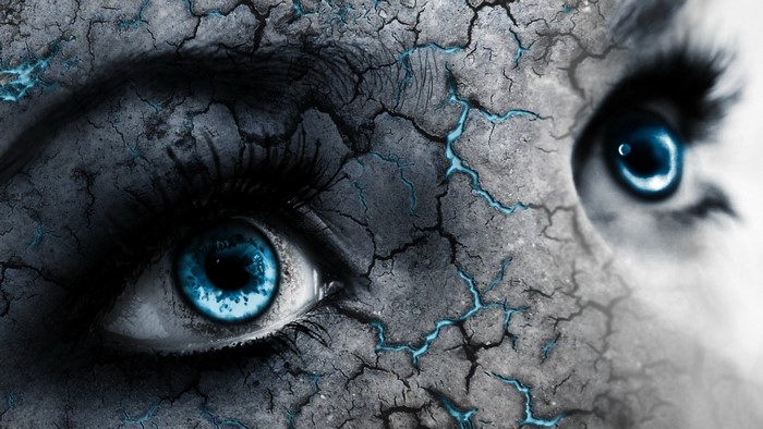 Close up of cracked skin and blue eyes