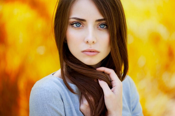 Portrait of a Woman with Blue Eyes and Auburn Hair