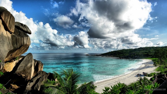 Tropical beach with granite boulders and turquoise water