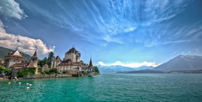 Castle on Lake Thun, Switzerland with Mountains