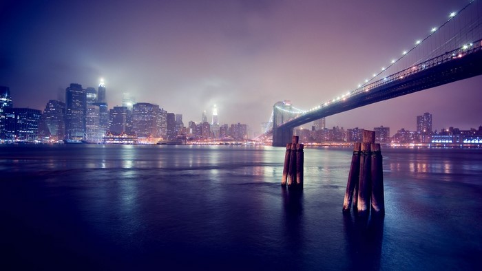 New York City skyline and Brooklyn Bridge at night