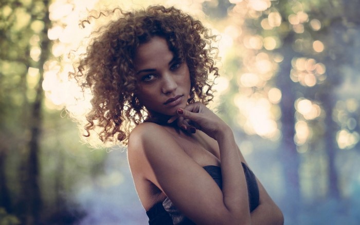 Rose Bertram with curly hair outdoors
