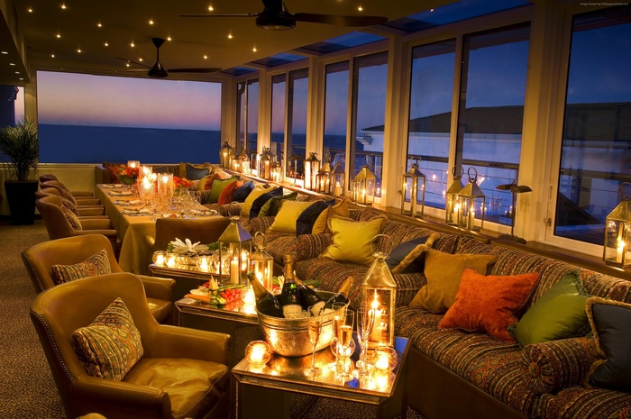 Elegant dining room with ocean view at sunset