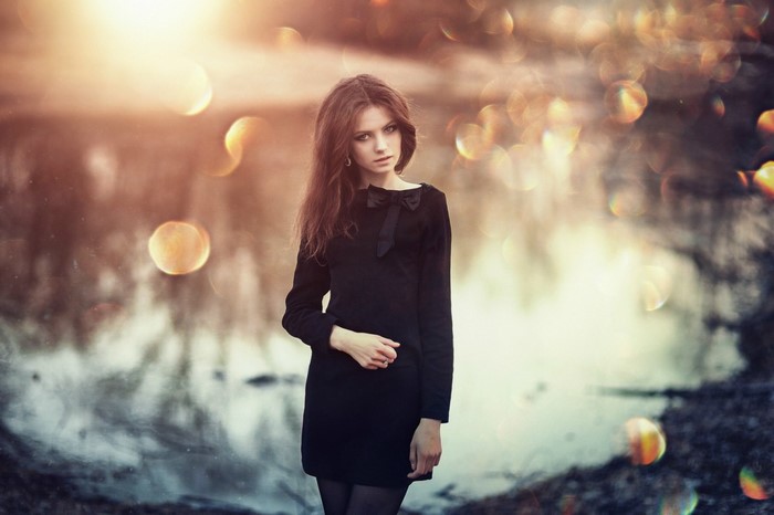 Woman in black dress by Sergey Piltnik