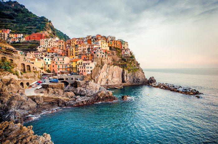 Manarola, Italy: Colorful buildings on a cliff overlooking the sea