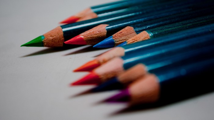 Close-up of colorful pencils on a gray background