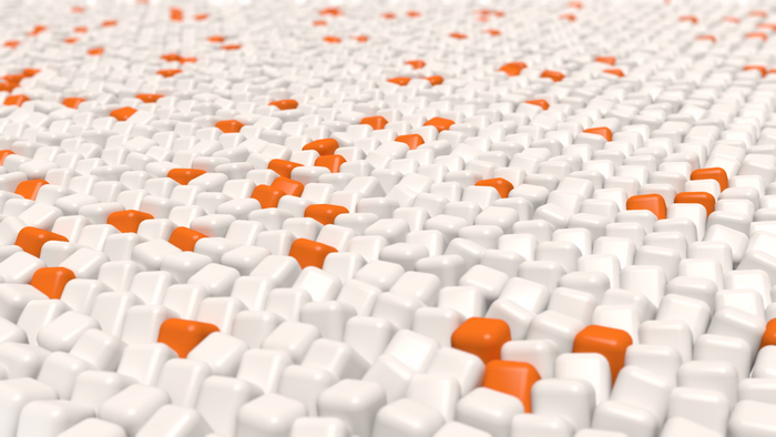 Abstract pattern of white and orange cubes