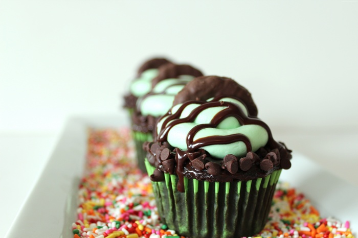 Mint chocolate cupcakes with chocolate drizzle and sprinkles