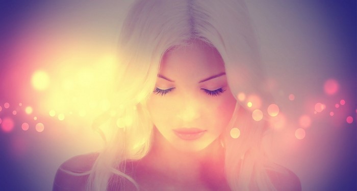 Woman with blonde hair and bokeh lights