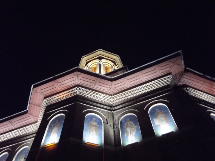 Church architecture at night with illuminated windows