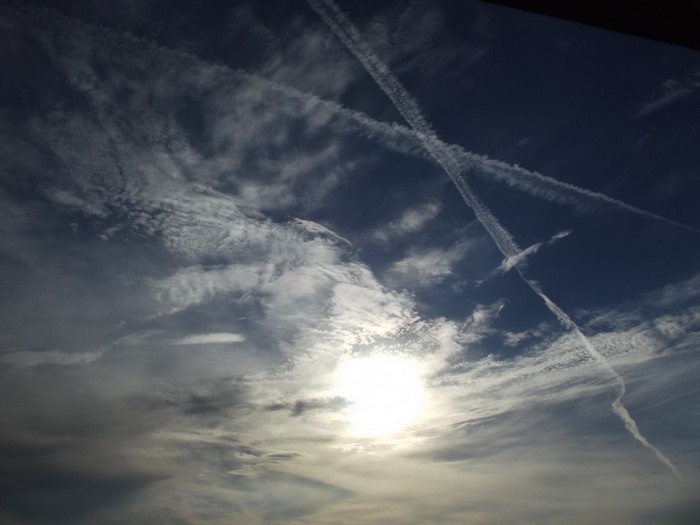 Sunlight and contrails in the sky