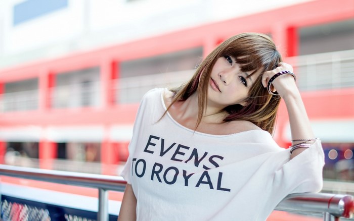 Woman with bracelets and text on shirt