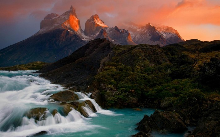 Torres del Paine National Park mountains and river at sunset