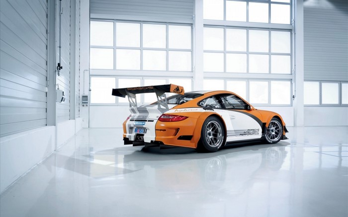 Porsche 911 GT3 race car in a garage