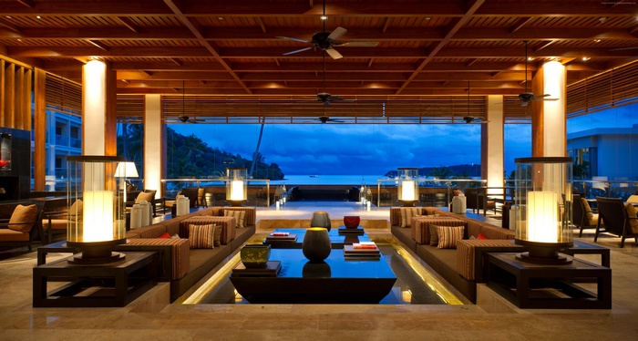 Luxury resort lobby with ocean view at dusk