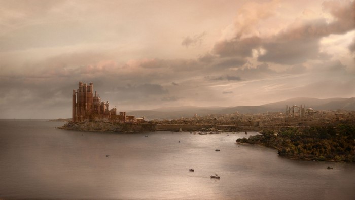 Red Keep castle overlooking a bay at sunset