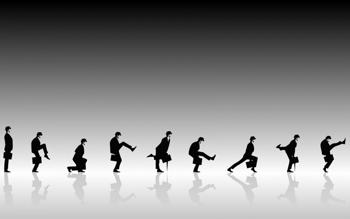 Silhouettes of a man in a suit performing dance moves