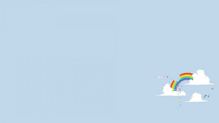 Airplane flying through a rainbow and clouds