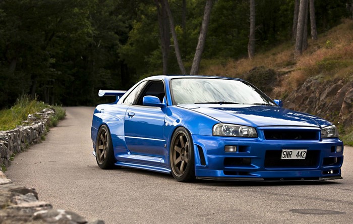 Blue Nissan Skyline GT R R34 on Road