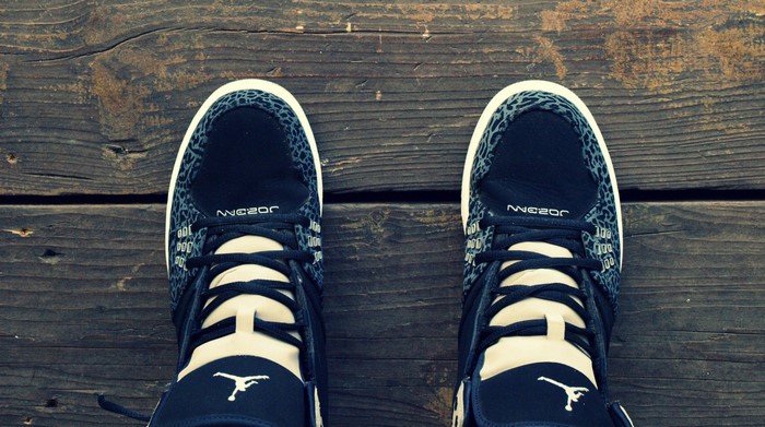 Air Jordan sneakers on a wooden surface