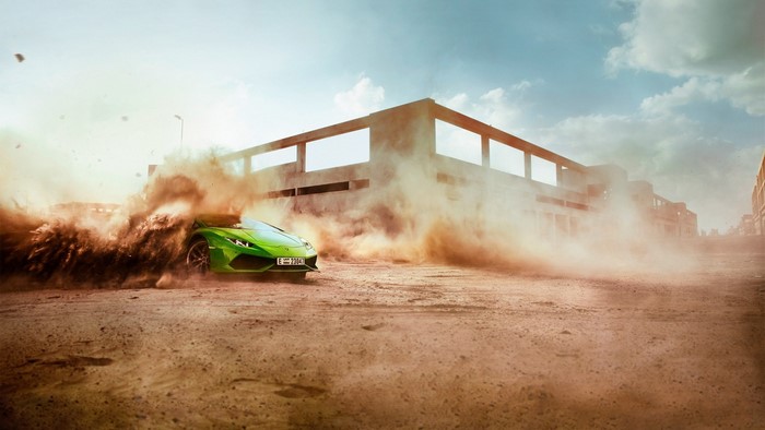 Green Lamborghini driving through dust near building