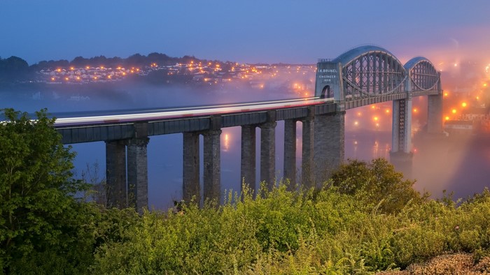 Brunel's Bridge over a misty river at dusk