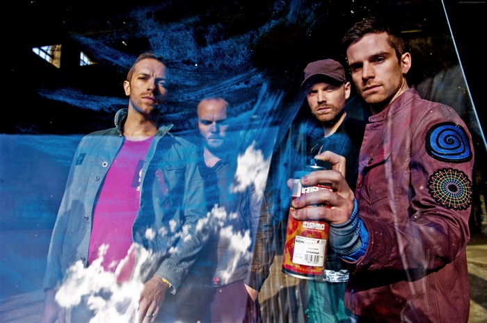 Coldplay band members with spray can