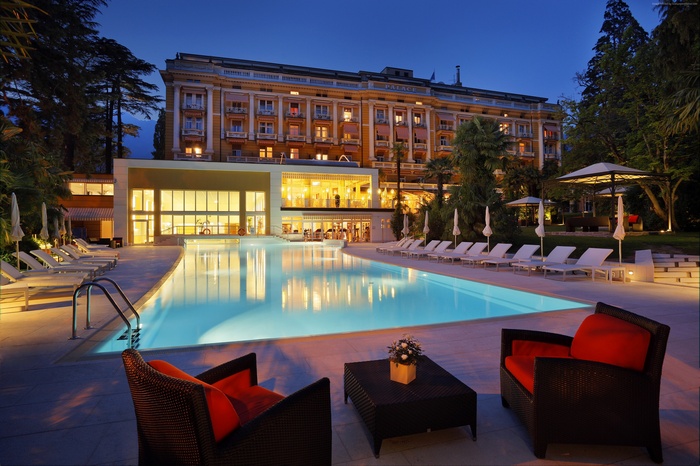 Palace Merano Resort with Outdoor Pool at Night