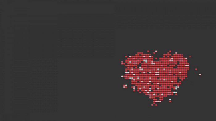 Heart shape made of dots on a dark background