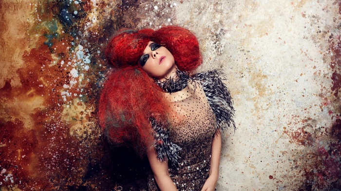 Bjork with red hair and avant-garde dress