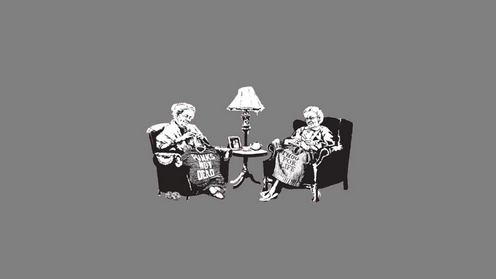 Two elderly women knitting with punk slogans