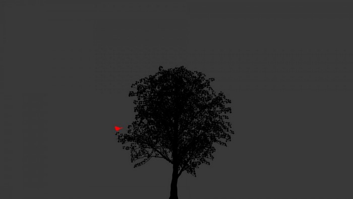 Silhouette of a tree with a red bird