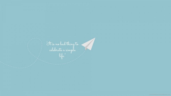 Paper airplane with quote on blue background