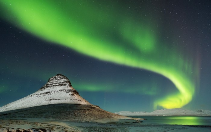 Aurora Borealis over Kirkjufell mountain in Iceland