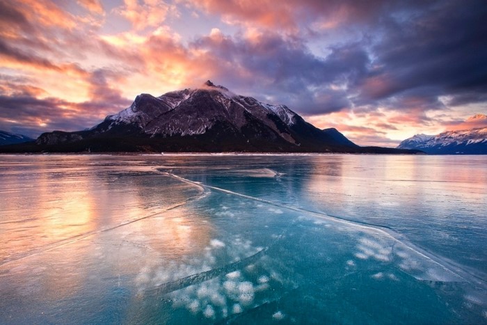 Frozen lake and mountains at sunset, Canada